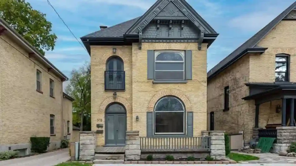 Historic brick home with dark gray painted trim