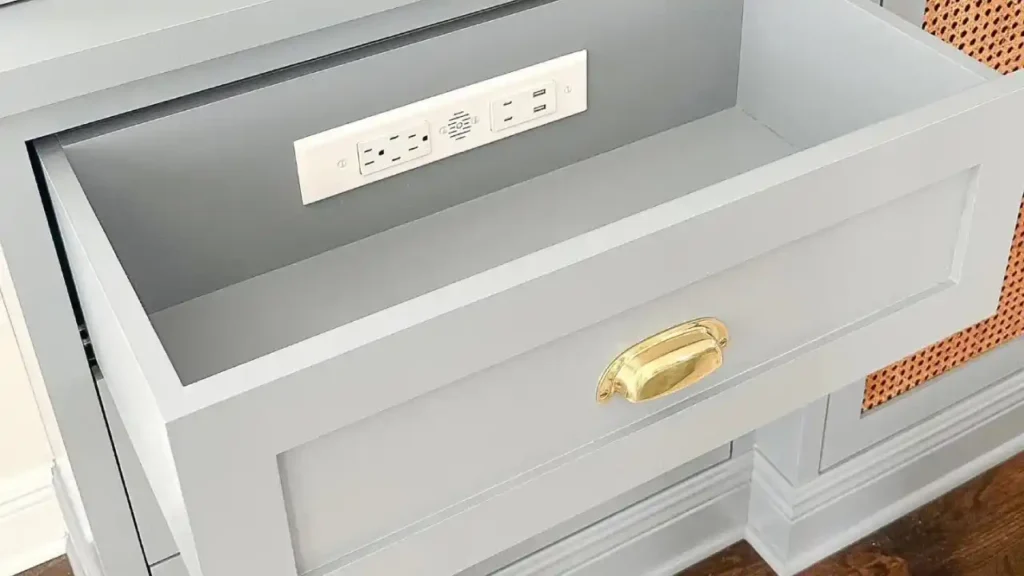 White painted cabinet drawer with a brass pull
