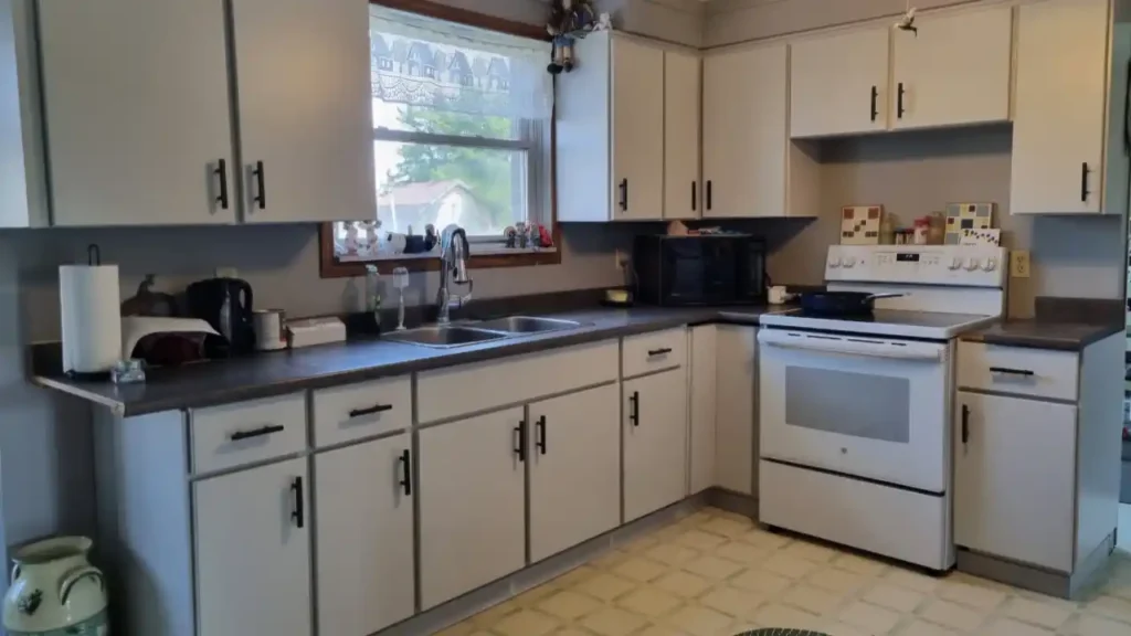 Kitchen with light gray painted cabinets
